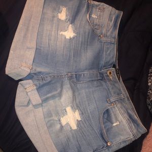 Light washed jean shorts with rips